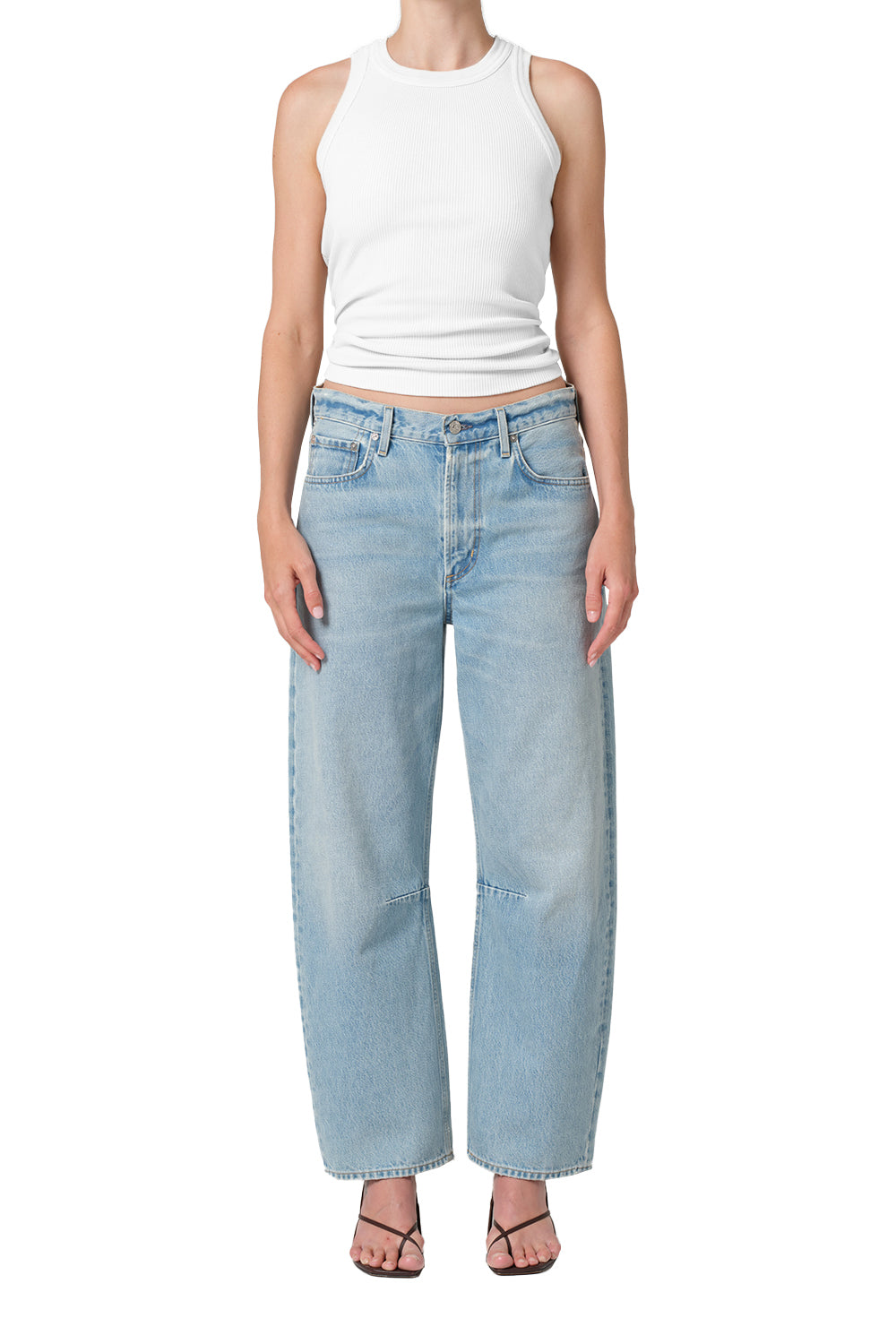 Light vintage indigo denim with subtle whiskering and soft fading