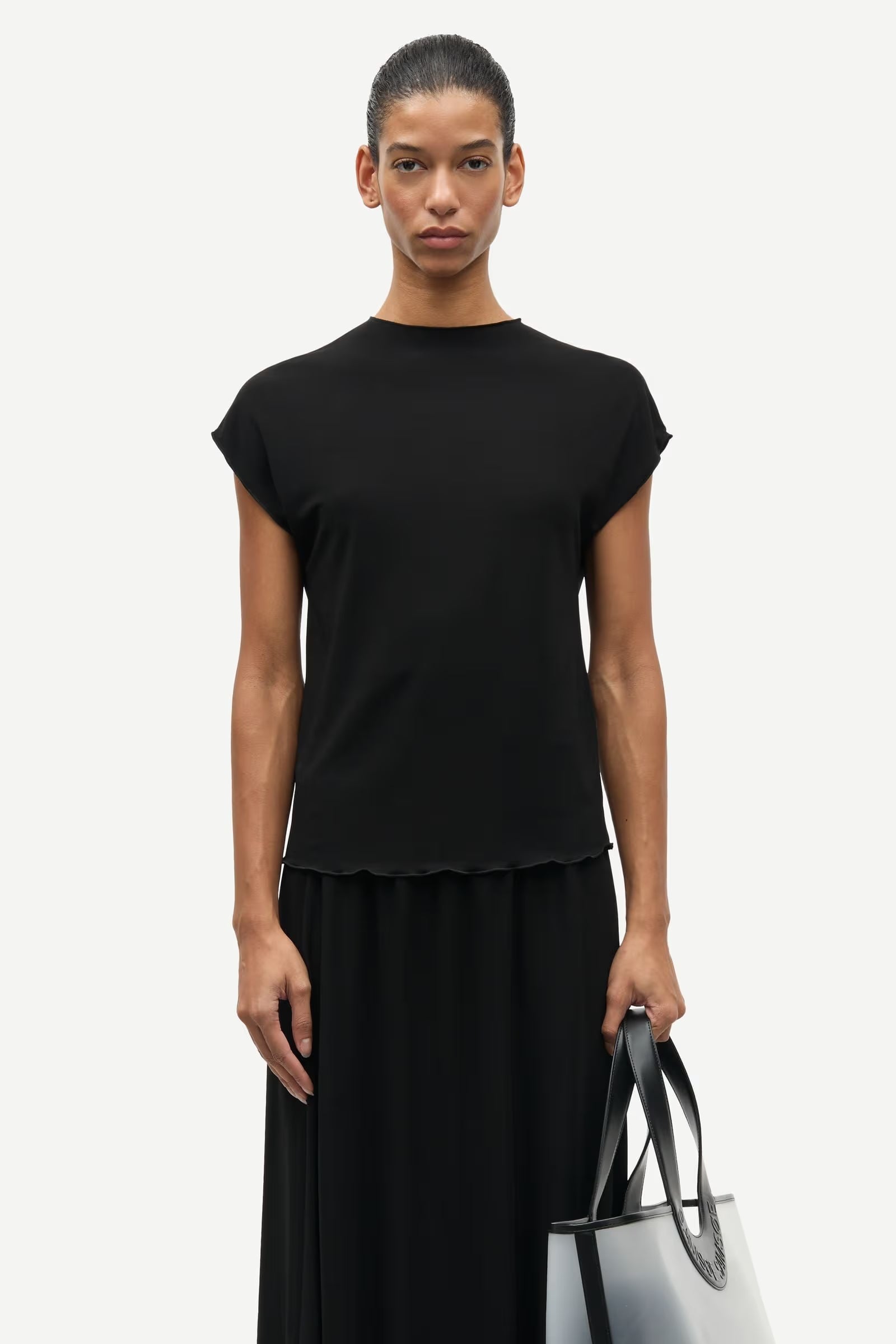 Samsøe Samsøe Saumi black short-sleeved jersey top with feminine lettuce-edge neckline and hem.
