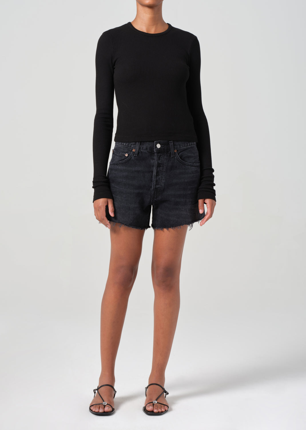 Saturated black mid thigh short with raw hems