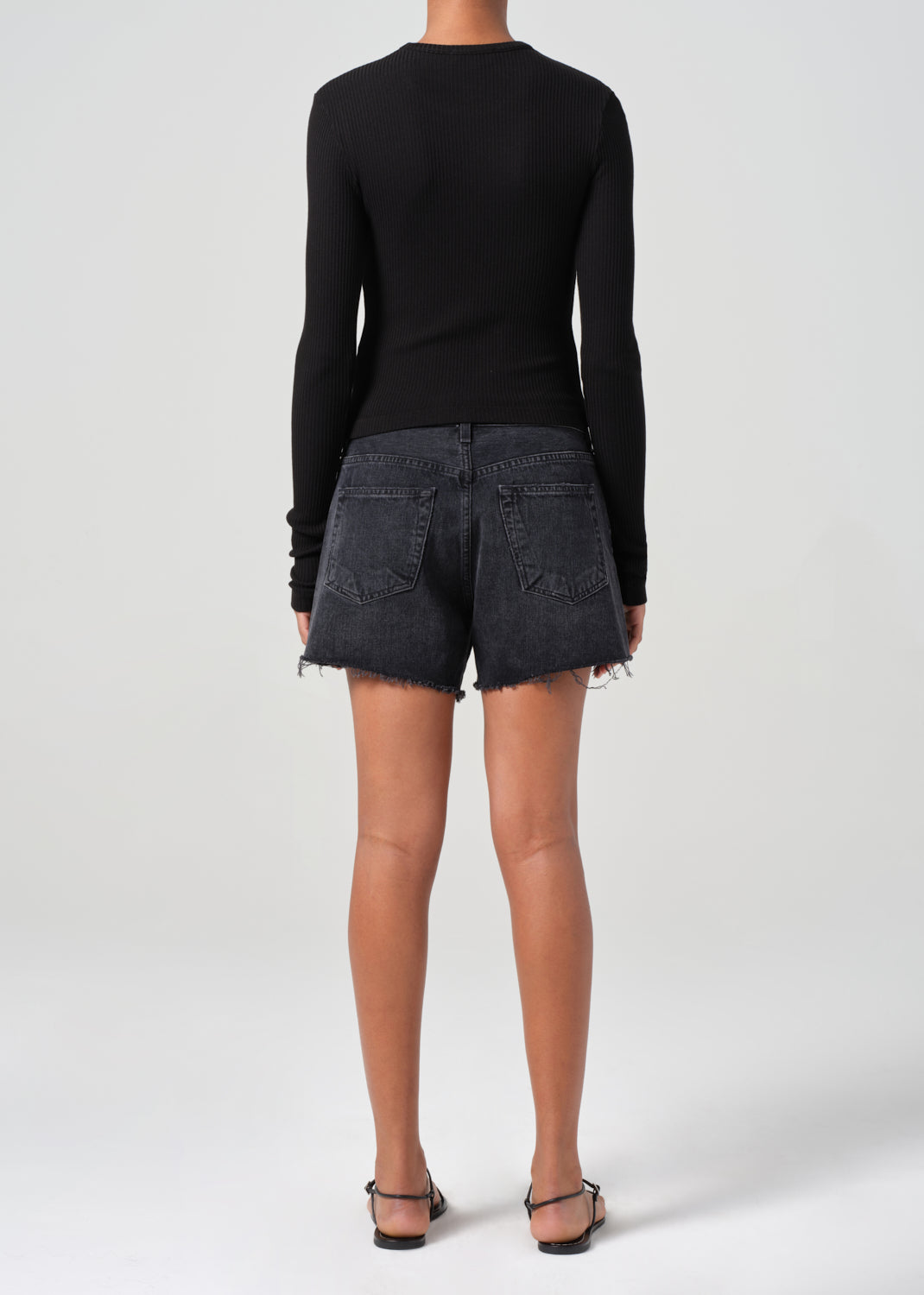 Saturated black mid thigh short with raw hems