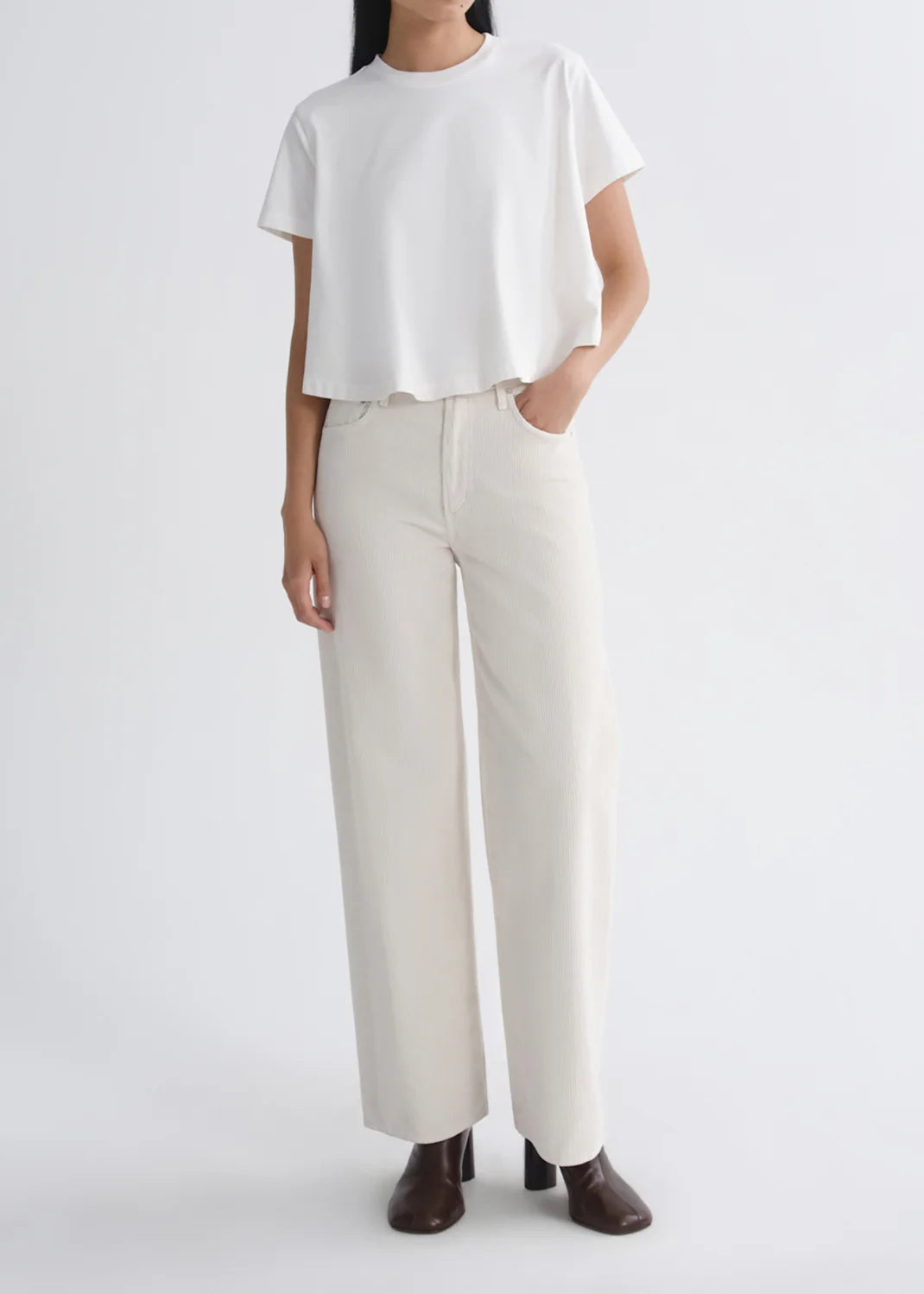 AGOLDE Ren High Rise Wide Leg 32-inch corduroy pants in Bone off-white with fine vertical ribs and an elongated wide leg.