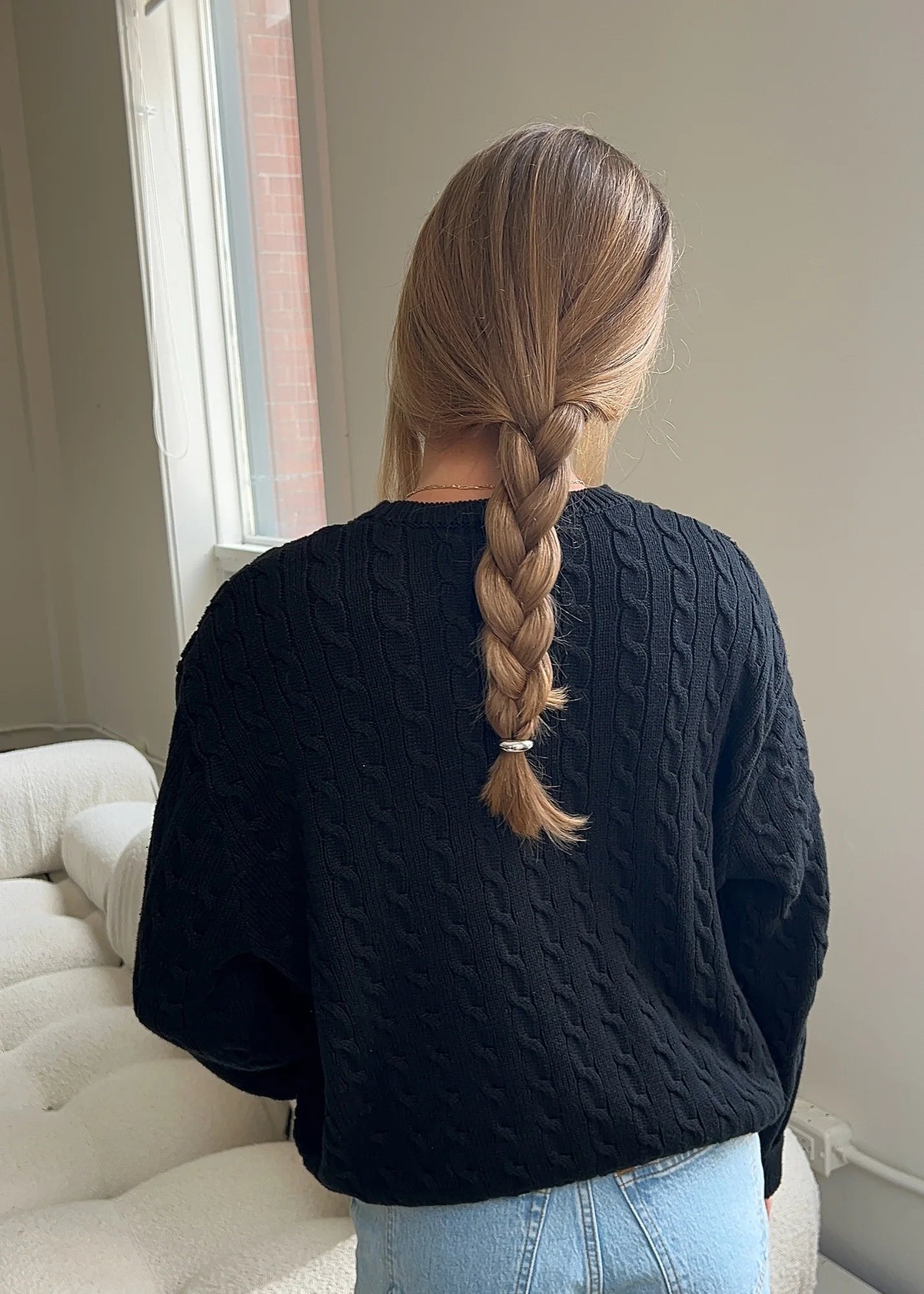 Model wearing stacked silver hair cuffs in a polished updo