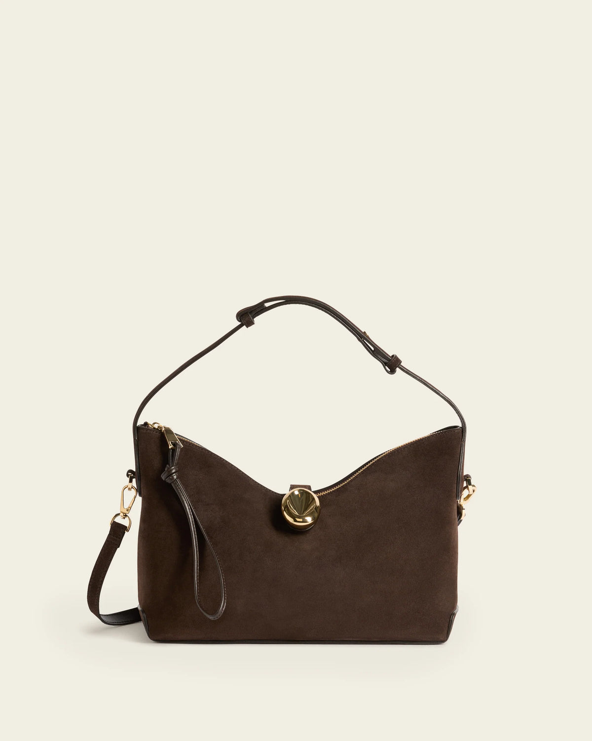 Flattered Gaia chocolate brown suede handbag with top handle and crossbody strap.