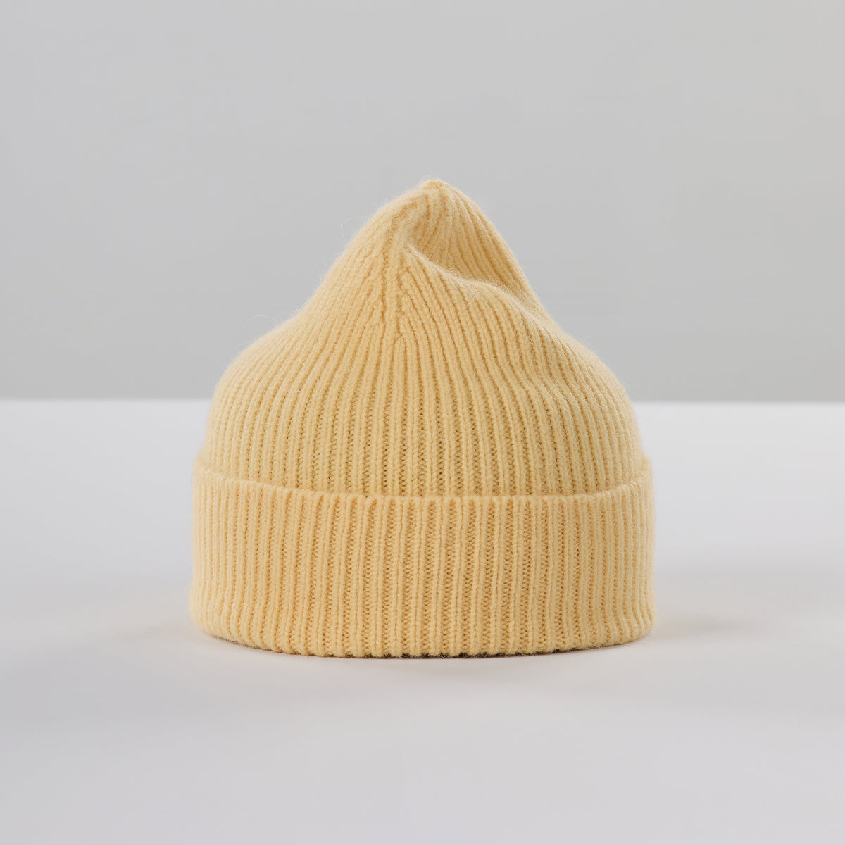 Classic blonde yellow ribbed knit lambswool beanie toque.