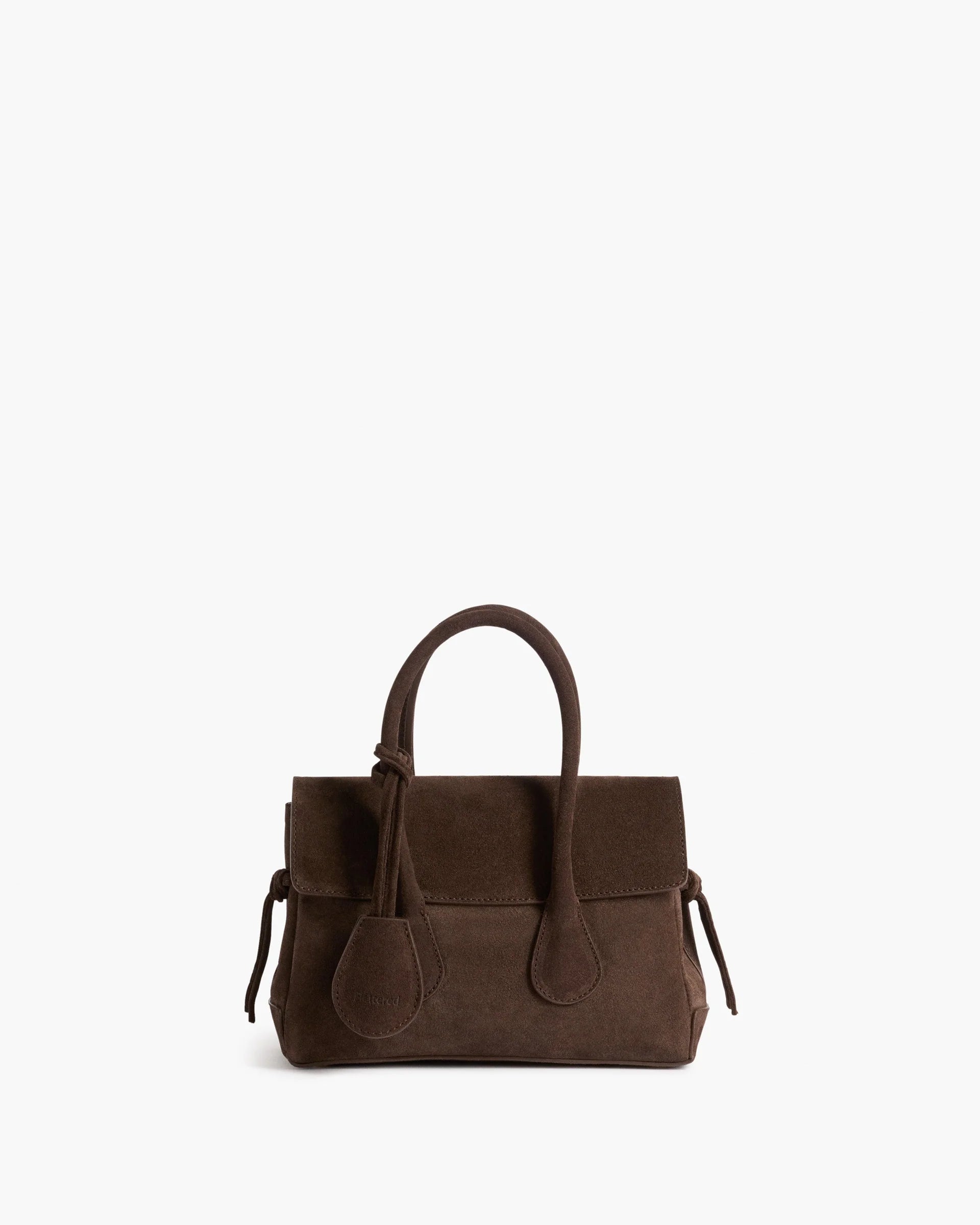 Flattered Lydia Mini structured top-handle handbag in chocolate brown suede featuring an adjustable crossbody strap.