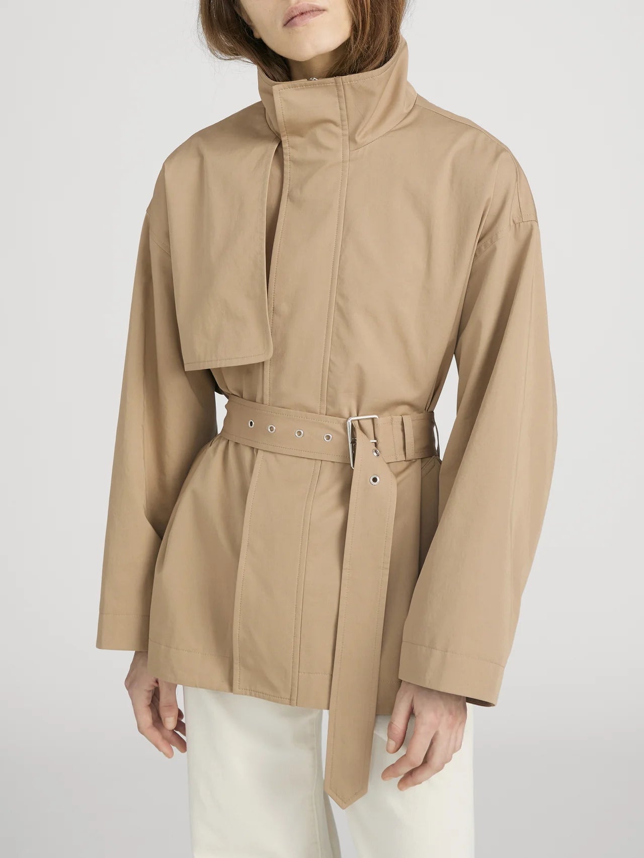 FRAME The Short Field Trench jacket in Khaki tan cotton fabric featuring a stand collar and adjustable waist belt.