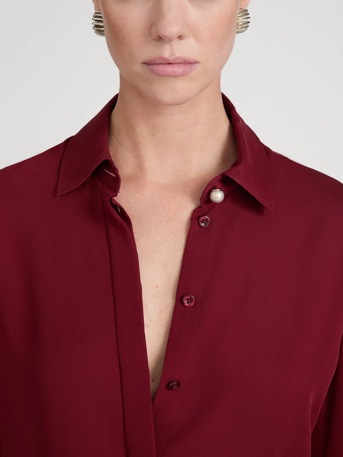 FRAME The Pearl Decor Standard dark grey button-down shirt with pearl embellishments.
