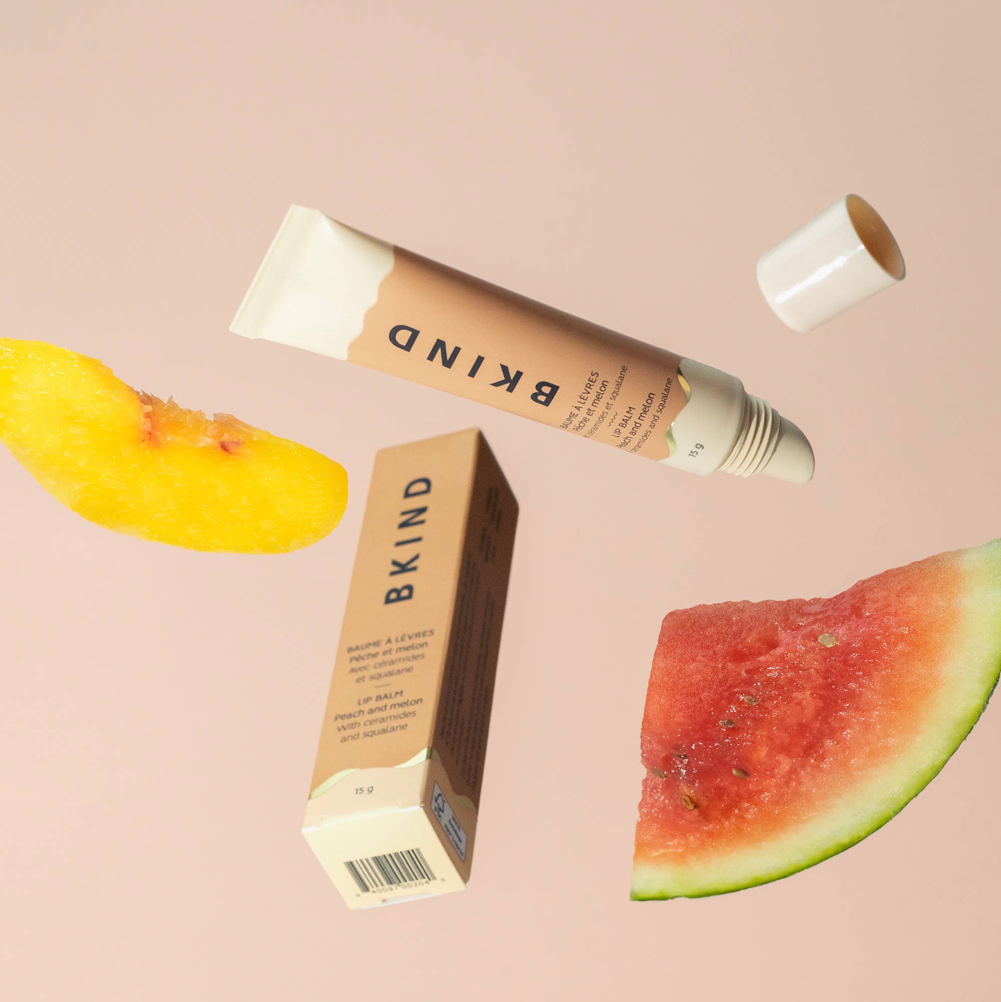 BKIND Nourishing Ceramide Lip Balm tube in Peach and Melon scent