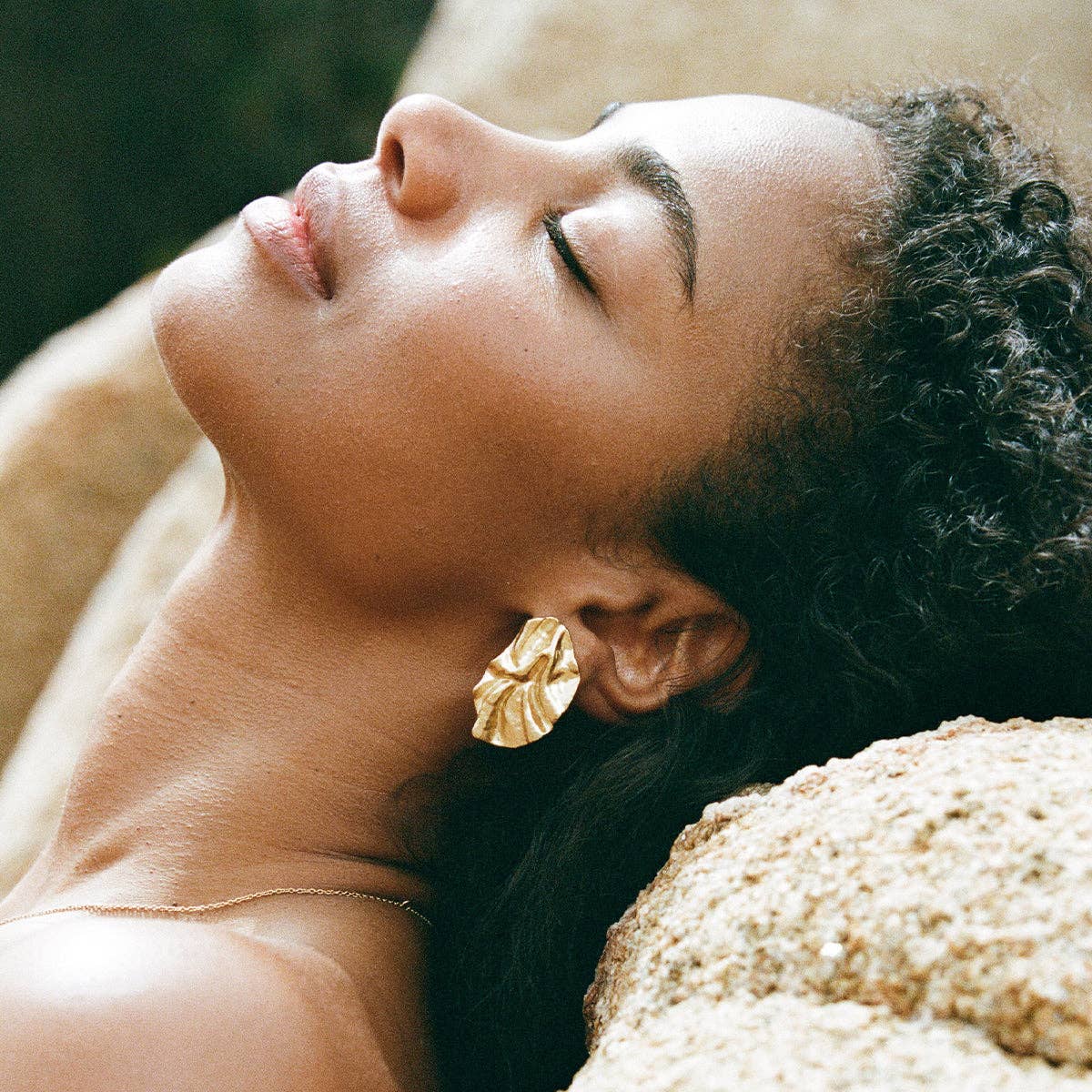 Agapée Batla gold petal earrings with fabric-like texture