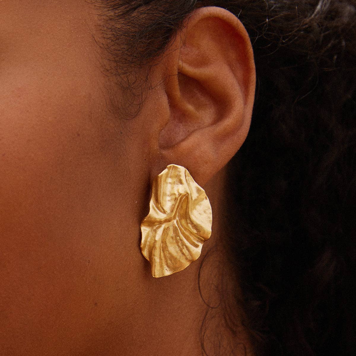 Agapée Batla gold petal earrings with fabric-like texture