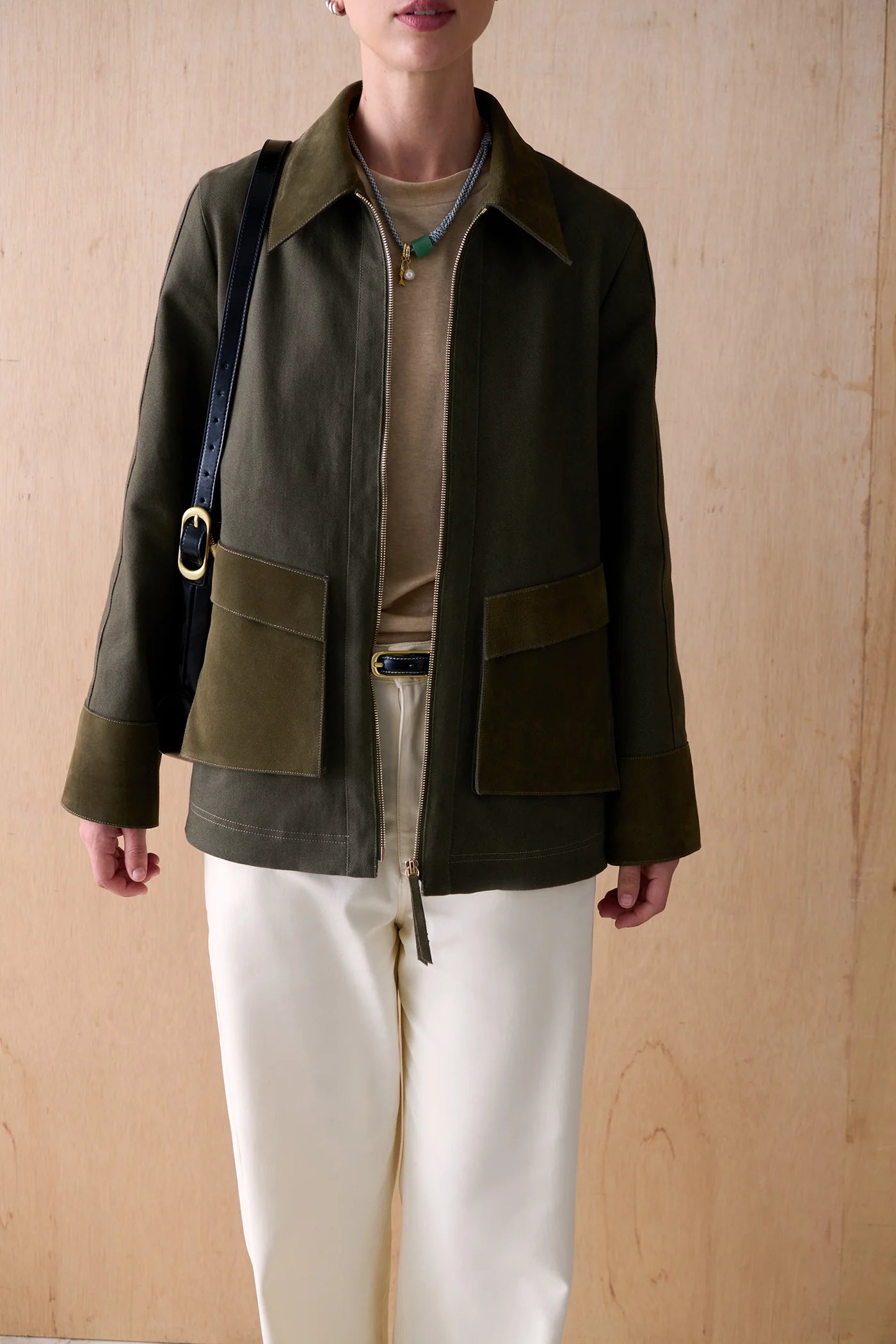 Sancia The Brooklyn evergreen cotton canvas utility jacket featuring contrasting suede trim and front zip closure.