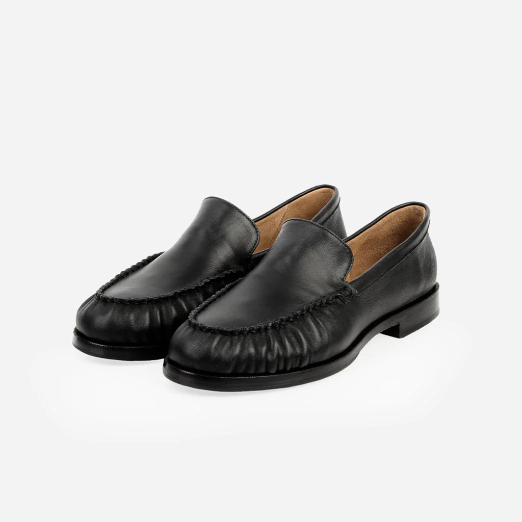 Poppy Barley The Laid-Back black leather loafers with ruched detailing and memory foam insoles.
