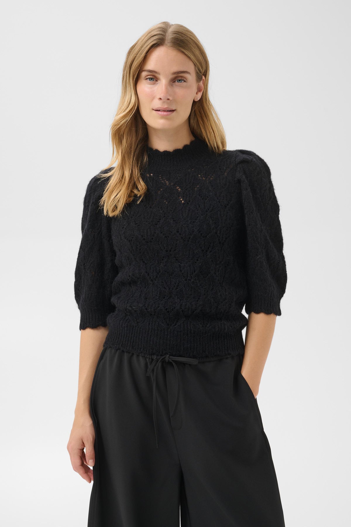 Part Two Dothie black pointelle openwork knit sweater with puff half-sleeves.