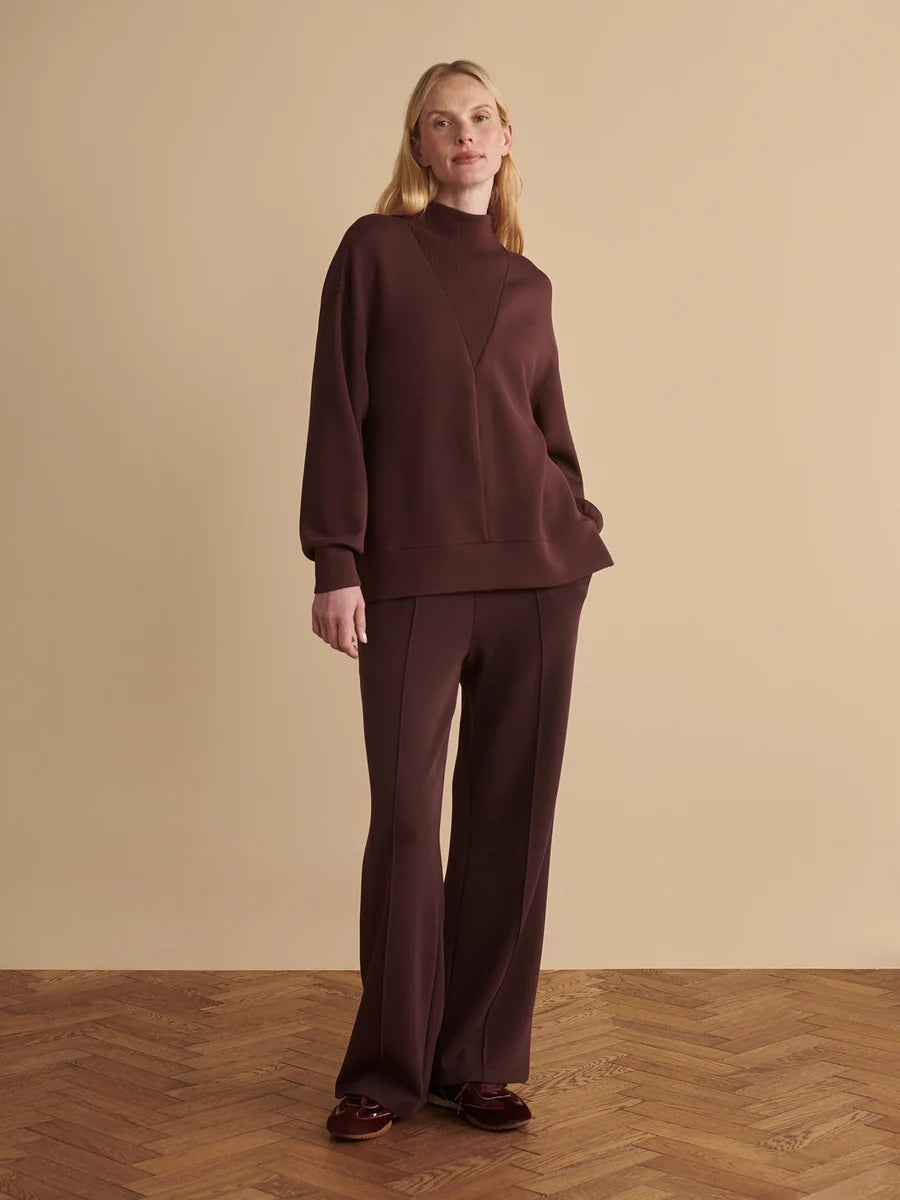 Varley Novi deep mahogany brown DoubleSoft longline mock neck sweatshirt with side slits.