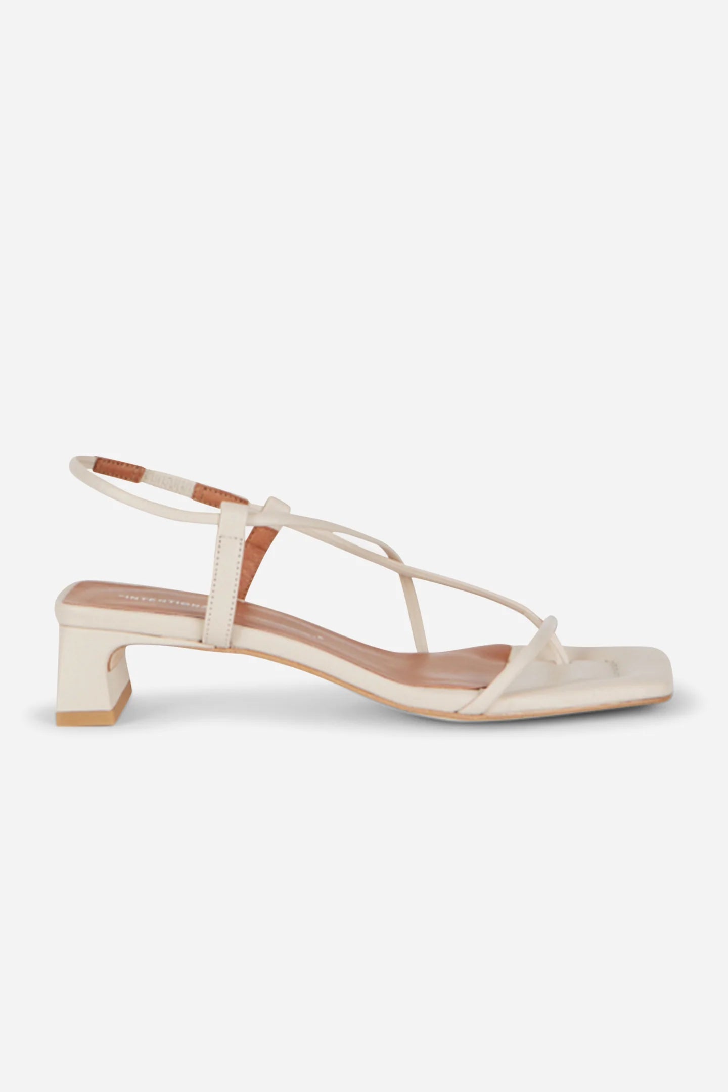 Intentionally Blank Anca three-strap Mary Jane heels in black patent leather with a square toe and block heel.