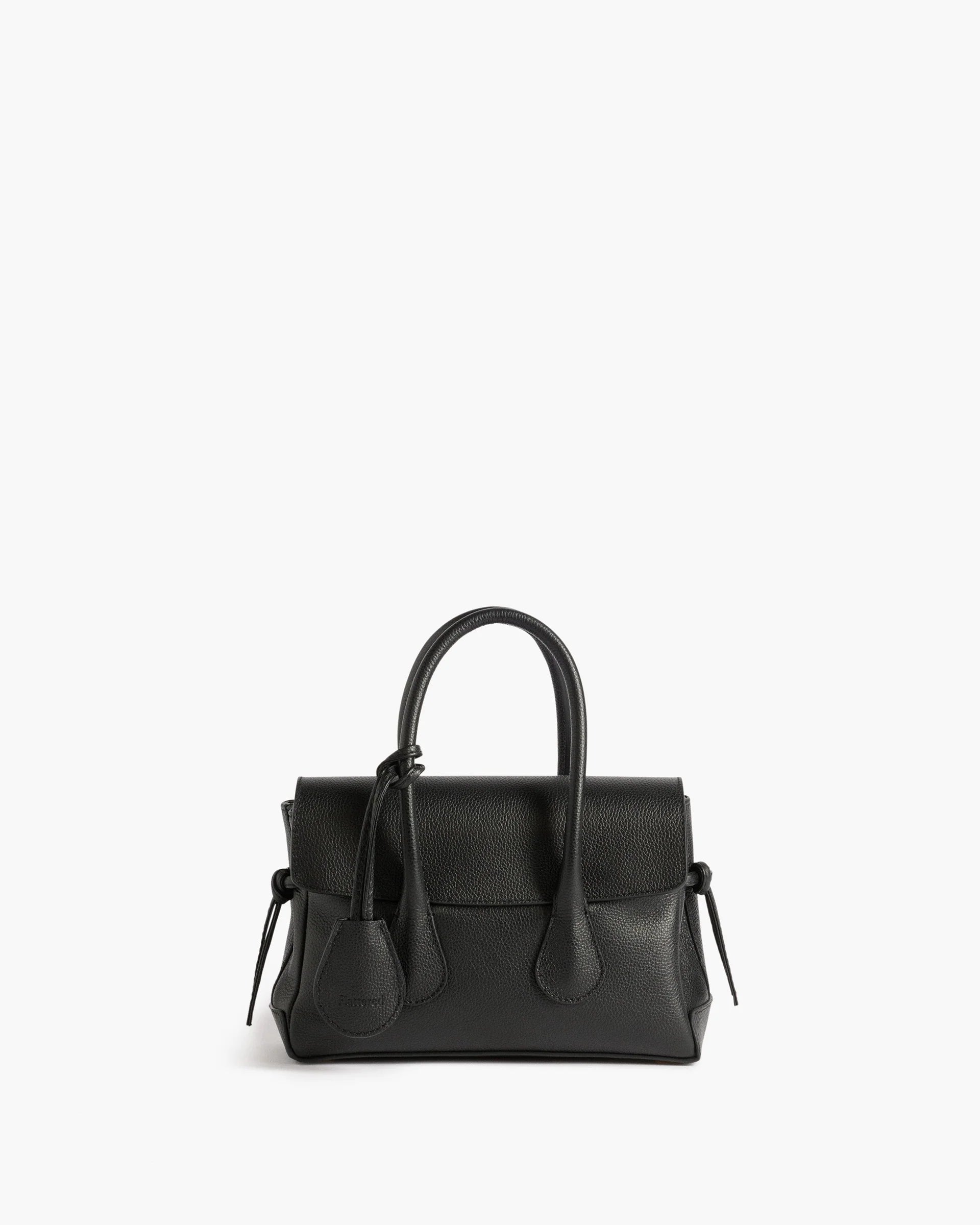 Flattered Lydia Mini structured top-handle handbag in black grained leather featuring an adjustable crossbody strap.