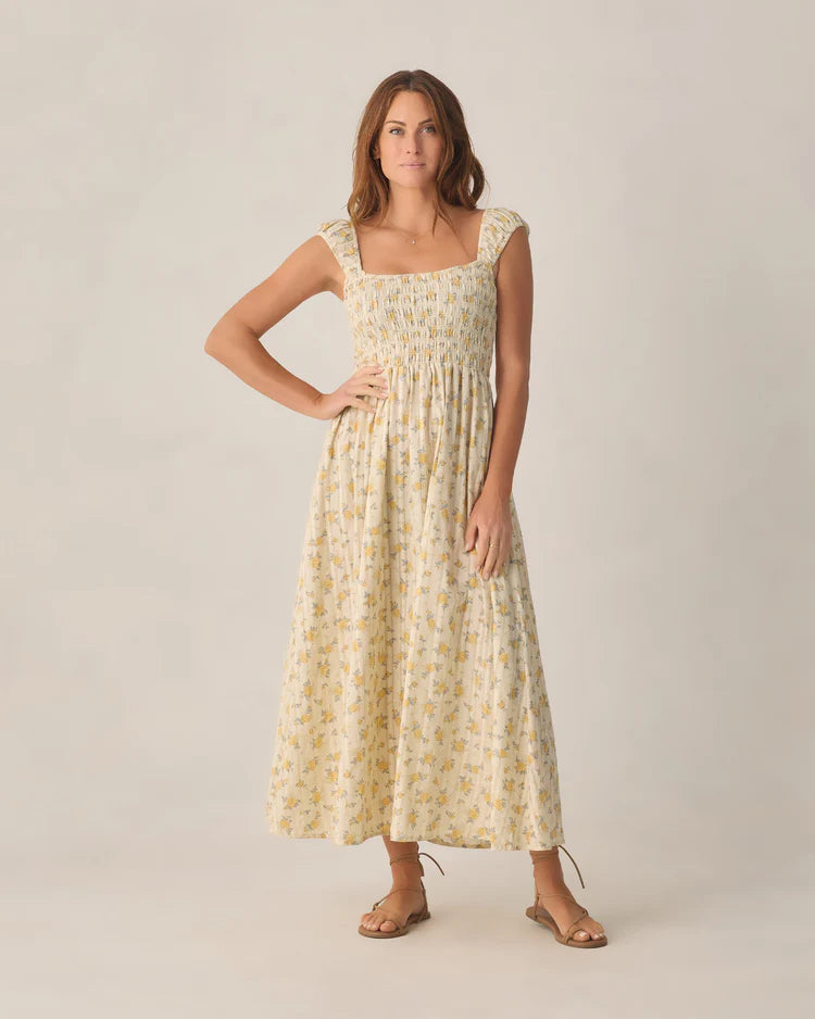 Rylee + Cru Women's Ivy dress in natural cream with a yellow Lemon Ditsy Flower floral print and smocked bodice.