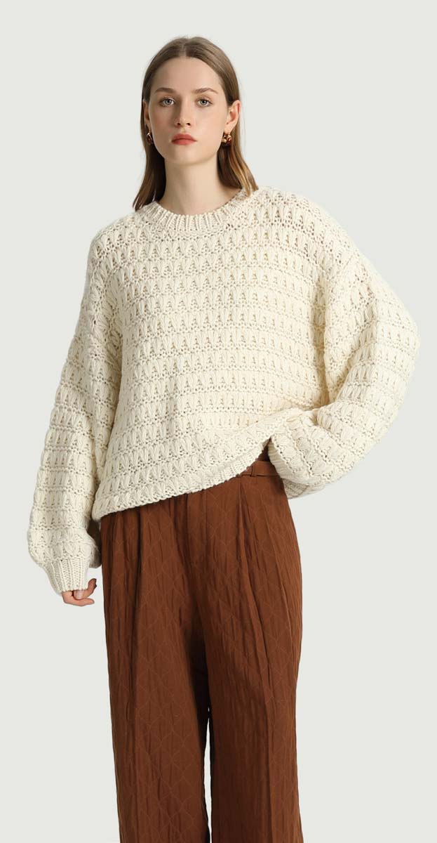 KORNER Bianca chunky textured open-knit pullover sweater in cream.