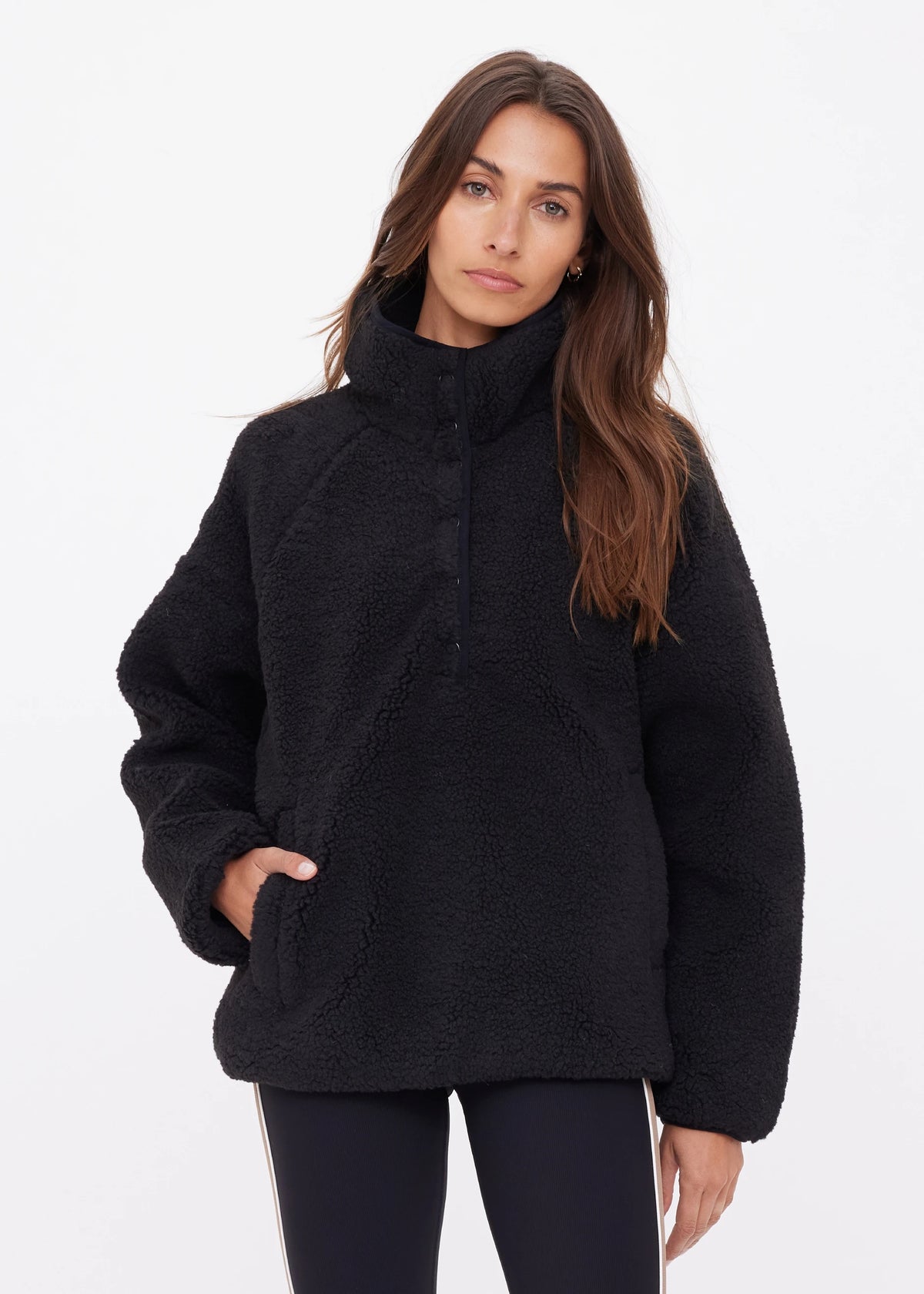 The Upside Harlow half-snap plush fleece pullover sweater in black.