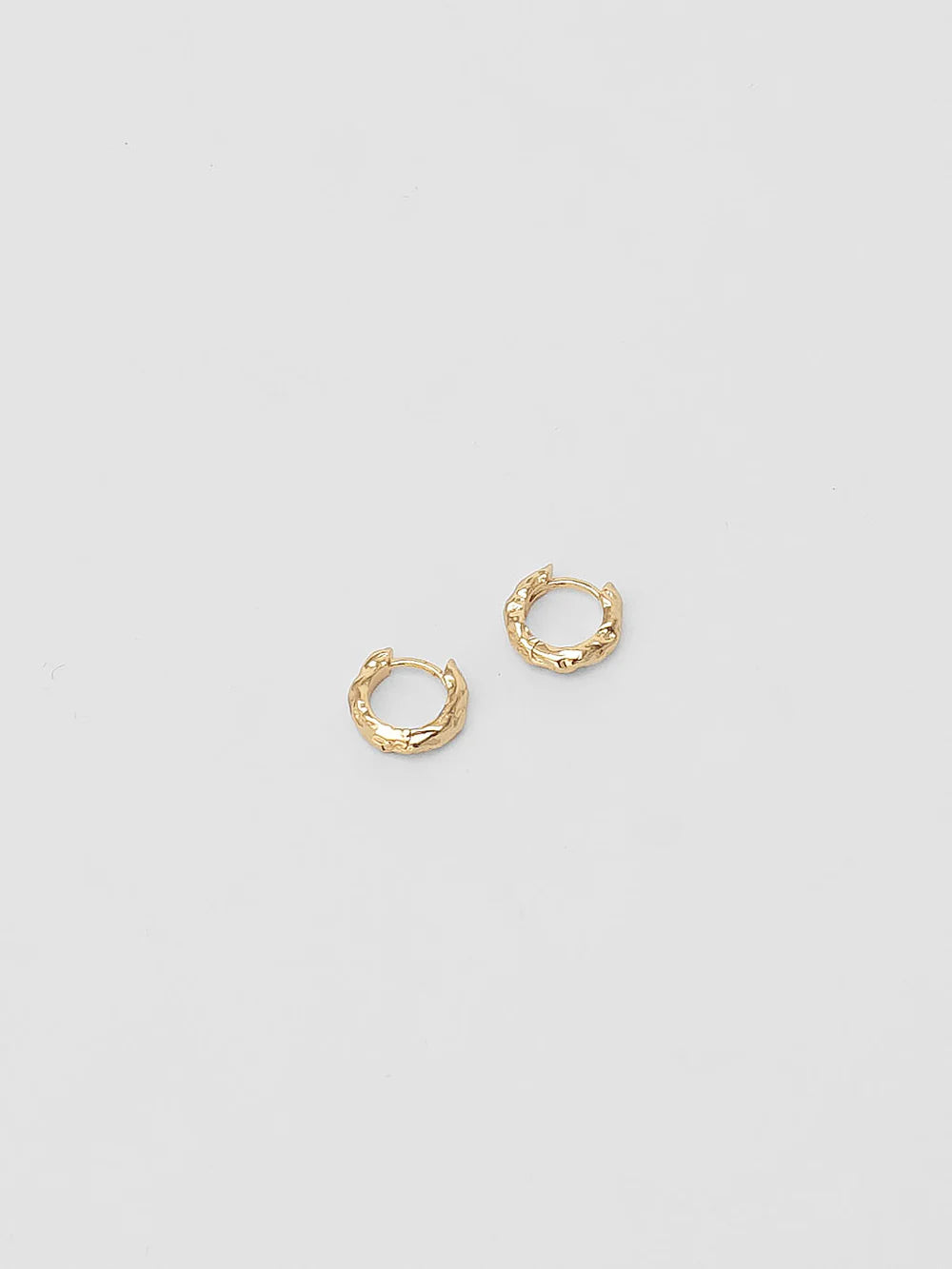 Wolf Circus Organic Huggie Hoop Earrings in gold front profile view