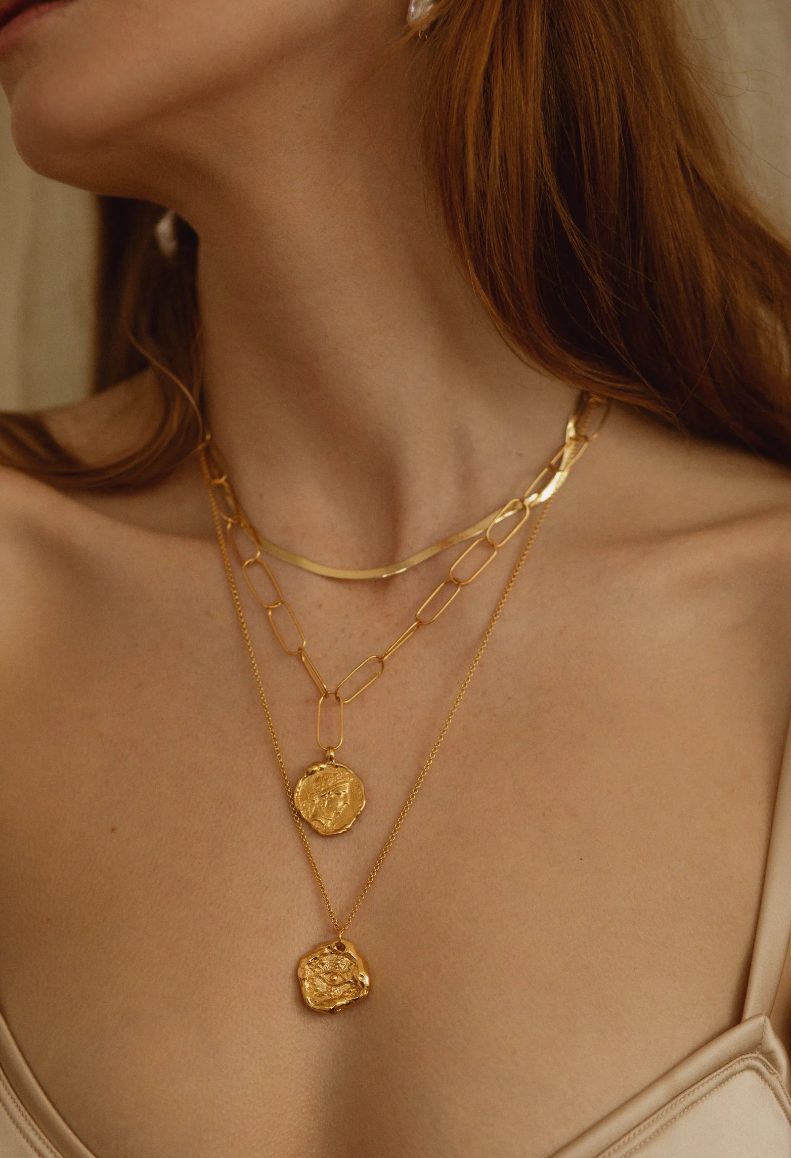 Pamela Card Her Watchful Gaze gold nazar amulet necklace with molten edges.