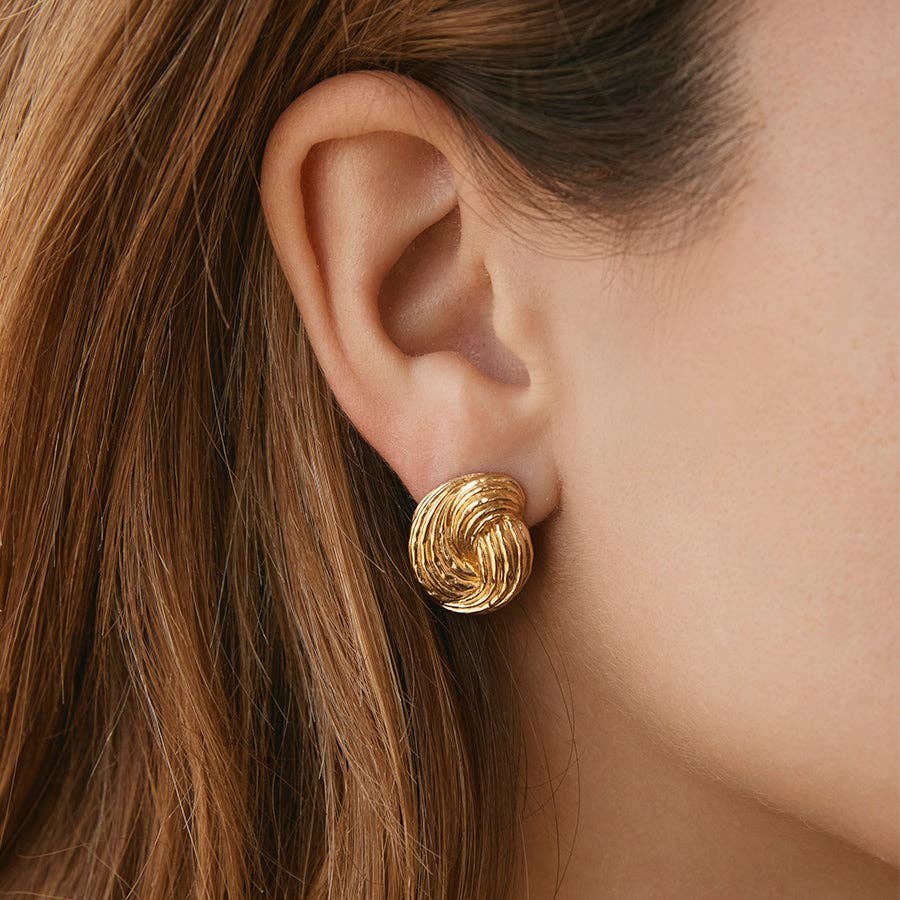 Agapée Claudia chunky gold twist knot earrings with ridged texture