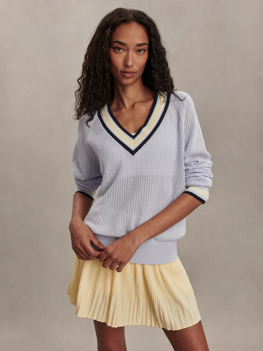 Varley Maurice short V-neck pointelle-knit sweater in Xenon Blue with striped cuff and neck trims.
