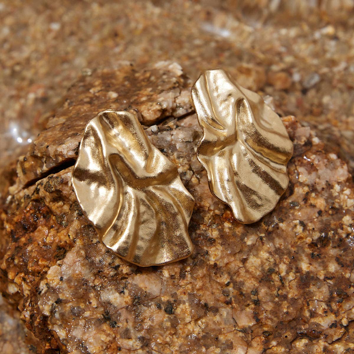 Agapée Batla gold petal earrings with fabric-like texture