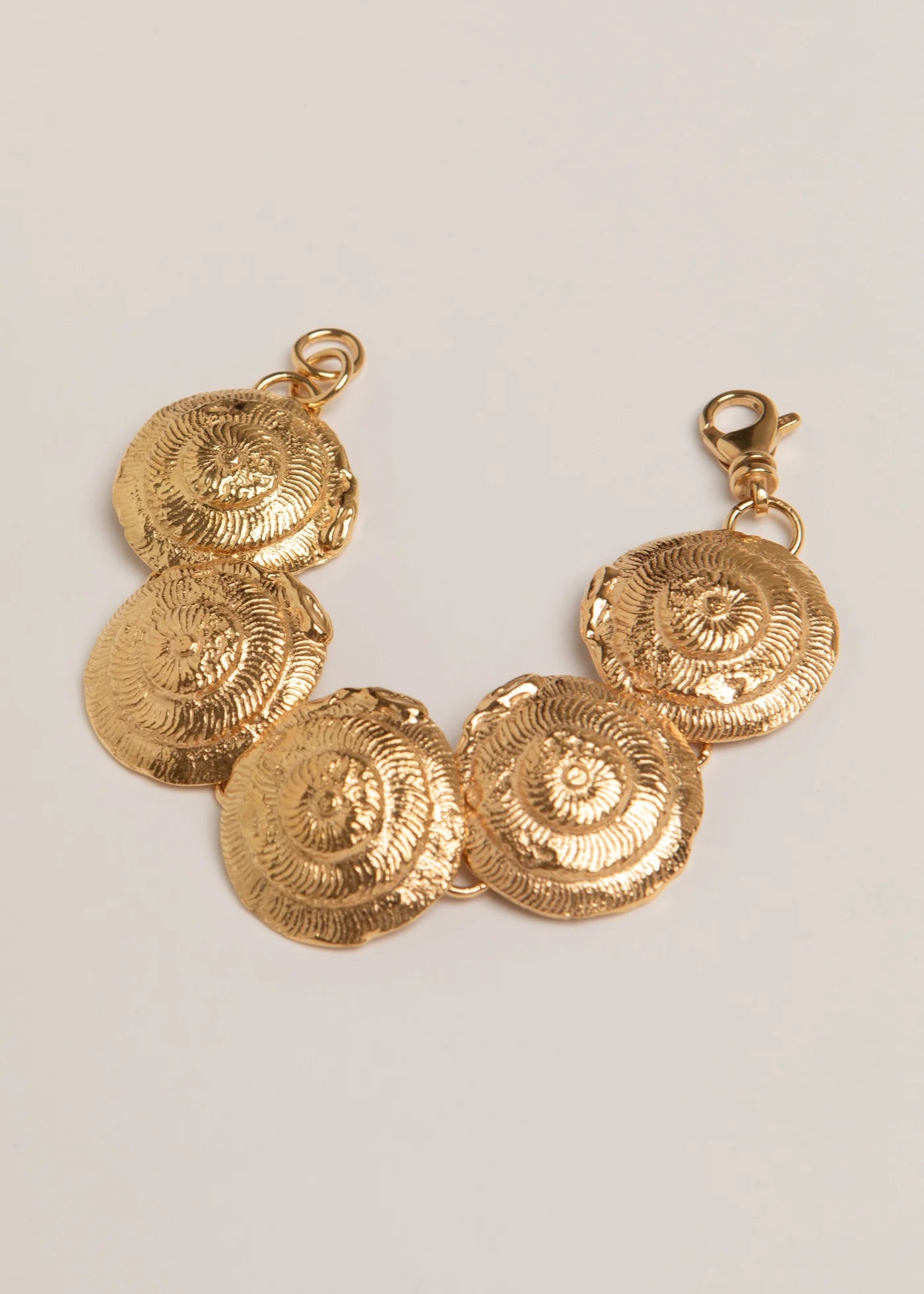 Pamela Card Profound Emotion 24K gold vermeil bracelet with large molten shell swirls and adjustable clasp.