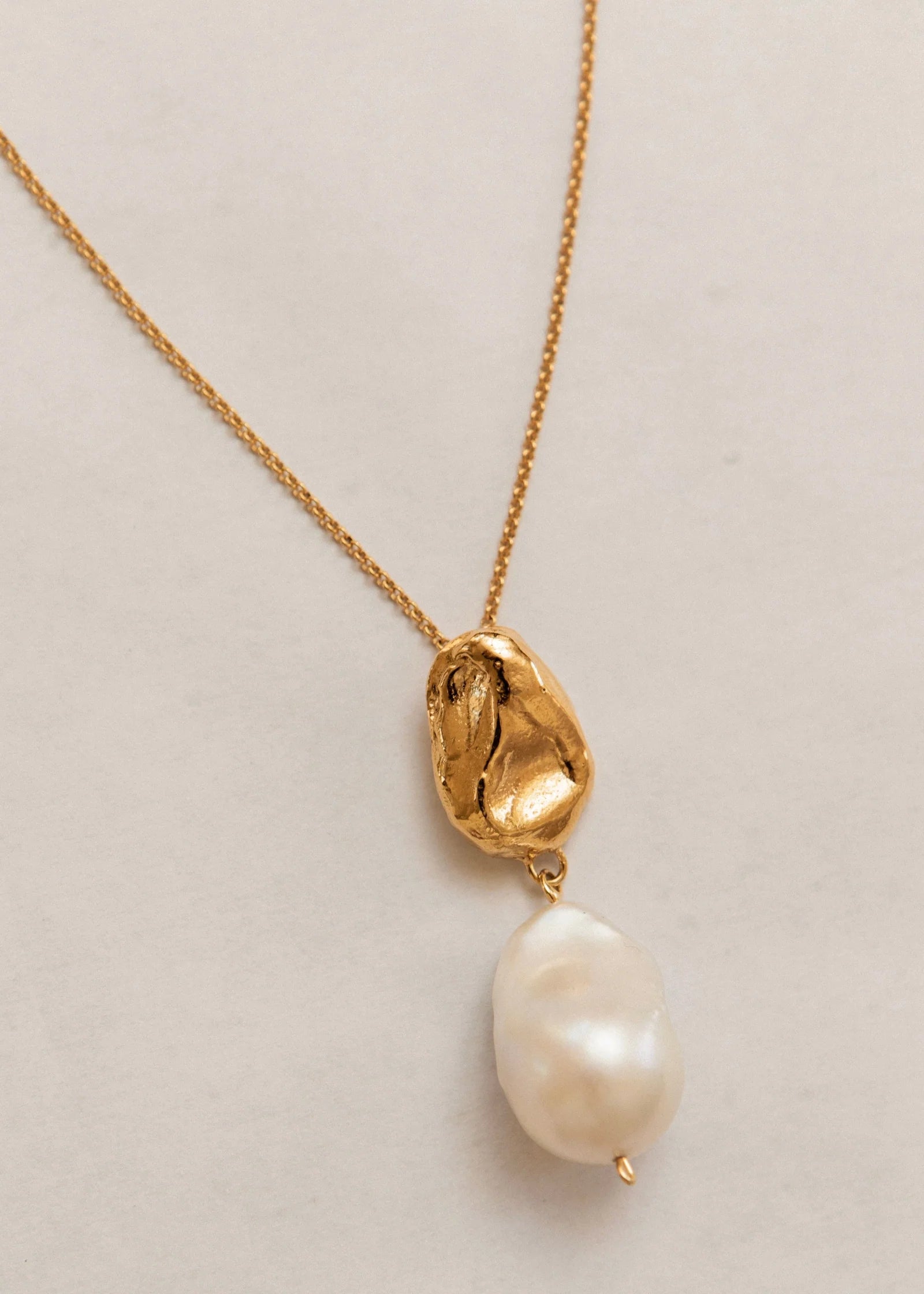 Pamela Card Infinite Terrazza 24K gold necklace with a molten wax-cast pendant and large baroque pearl.